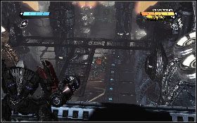 W kolejnej lokacji skieruj się do stalowych drzwi z lewej [1] - - Część 1 - Ciemny Energon (4) - Opis przejścia - Transformers: Wojna o Cybertron - poradnik do gry