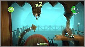 Kawałek dalej trafimy na wielkie obrotowe koło - wysoko nad nim jest bańka z przedmiotem - Chwytaj i bujaj | Kryjówka Da Vinci | LittleBigPlanet 2 - LittleBigPlanet 2 - poradnik do gry