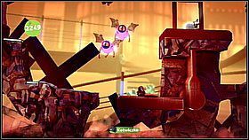 Mijamy przeciwnika uderzającego o ziemię i wchodzimy na skały w tle - Gdzie jest Avalon Centryfuga | Kosmos | LittleBigPlanet 2 - LittleBigPlanet 2 - poradnik do gry