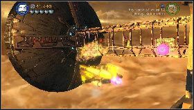 Na zakończenie przełącz się na postać w samolocie (lub wsiądź do niego ponownie), podnieś torpedy [1] i odpal je w trzy punkty [2] zaznaczone na moście przy wlocie do hangaru - Generał Grievous (2) | Tryb fabularny | LEGO Star Wars III The Clone Wars - LEGO Star Wars III: The Clone Wars - poradnik do gry