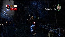 Przebiegamy dowolną postacią po moście na dalszą półkę skalną i bierzemy pochodnię - Isla de Muerta - opis przejścia | Klątwa Czarnej Perły | LEGO Piraci z Karaibów - LEGO Piraci z Karaibów - poradnik do gry