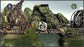 Wracamy tunelem na górę i przejeżdżamy przez wioskę aż do dwóch miejsc na kule - Pelegosto - opis przejścia | Skrzynia umarlaka | LEGO Piraci z Karaibów - LEGO Piraci z Karaibów - poradnik do gry