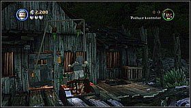 Przetaczamy klatkę przez most [1] i umieszczamy ją w mechanizmie otwierającym drzwi - Dotyk przeznaczenia - opis przejścia | Skrzynia umarlaka - LEGO Piraci z Karaibów - poradnik do gry