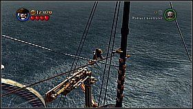 Na maszcie udajemy się na jego wąską odnogę, do której prowadzi lina - niszczymy uchwyt, aby opuścić ją na dół - Kraken - opis przejścia | Skrzynia umarlaka | LEGO Piraci z Karaibów - LEGO Piraci z Karaibów - poradnik do gry