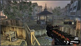 Przechodząc po stole opartym o płot [1] wejdziemy na niewielki plac z altanką [2] - Poziom 04- Przedmieścia | Opis przejścia | FEAR 3 - F.3.A.R. - poradnik do gry