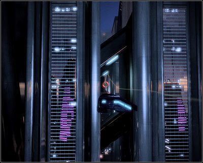 Kieruj się teraz w stronę niewielkiej dziury zlokalizowanej pomiędzy dwoma wieżowcami (powyższy screen) - (8) Kontynuowanie pościgu za Vasir z użyciem ścigacza - Kryjówka Handlarza Cieni - Mass Effect 2: Lair of the Shadow Broker - poradnik do gry