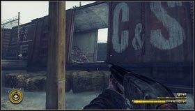 Spod słupa możemy wybrać się w dalszą drogę idąc w lewo i kierując się znakami [1] lub w prawo przechodząc przez wagon [2] - Rozdział 6 (1) | Opis przejścia Resistance 3 - Resistance 3 - poradnik do gry