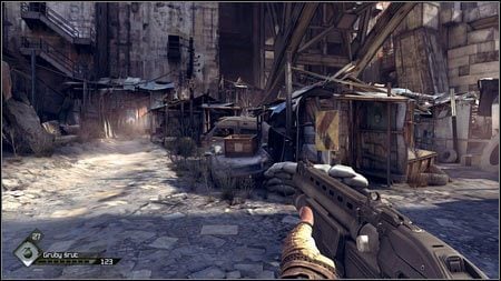 Dotrzesz w ten sposób na śmietnisko przypominające slumsy - Ulepszenie Defibrylatora (2) | Opis przejścia Rage 1 - Rage - poradnik do gry