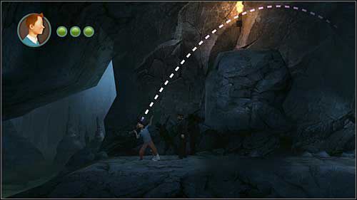 Kawałek dalej odpalisz pochodnię od ognia ponad skałką - Rozdział 24 - W podmorskich jaskiniach (2) - Opis przejścia - Przygody Tintina: Gra Komputerowa - poradnik do gry