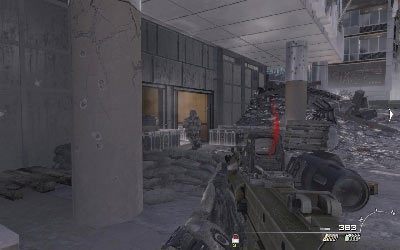 Staraj się trzymać lewej strony jezdni, ponieważ w pewnej chwili ujrzysz tutaj wejście do banku - III- Scorched Earth | Opis przejścia gry | Call of Duty Modern Warfare 3 - Call of Duty: Modern Warfare 3 - opis przejścia i operacje specjalne - poradnik do gry