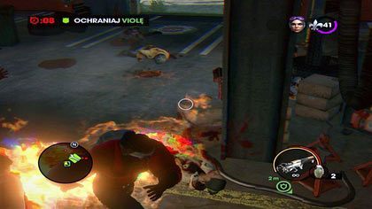 Do końca czasu musimy ochraniać Violę - jest to o tyle trudne, że zmierzają do nas Zombie-Brutale oraz Płonący Zombie - Atak zombie | Kampania Saints Row The Third - Saints Row: The Third - poradnik do gry