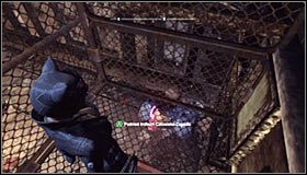 Udaj się teraz do miejsca, w którym znajduje się interaktywna kratka #1 i wciśnij SPACJĘ (lub przycisk A na padzie) żeby ją otworzyć - Park Row - Trofea Kobiety-Kota | Zagadki w Batman Arkham City - Batman: Arkham City - poradnik do gry