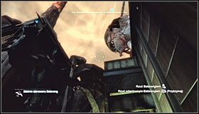 Zignoruj chwilowo widoczny w oddali pytajnik i udaj się na północ, zatrzymując się w pobliżu klatki z trofeum #1 - Dzielnica przemysłowa - Trofea Batmana (14-22) | Zagadki w Batman Arkham City - Batman: Arkham City - poradnik do gry