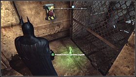 Wybierz z inwentarza wyrzutnię lin i wyceluj w znajdującą się za naelektryzowaną podłogą ścianę #1 - Dzielnica przemysłowa - Trofea Batmana (14-22) | Zagadki w Batman Arkham City - Batman: Arkham City - poradnik do gry