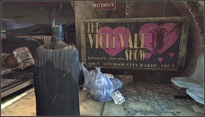 Odszukaj na peronie (niższy poziom) billboard reklamowy dotyczący programu Vicki Vale (powyższy screen) i zeskanuj go - Metro - Zagadki słowne, Szczęki Jokera, Trofea Kobiety-Kota | Zagadki - Batman: Arkham City - poradnik do gry