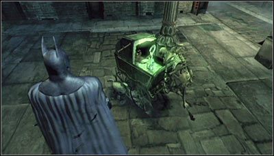 Trofeum ukryte jest w wózku (powyższy screen) pozostawionym niedaleko latarni - Cudowne Miasto - Trofea Batmana (01-07) | Zagadki w Batman Arkham City - Batman: Arkham City - poradnik do gry