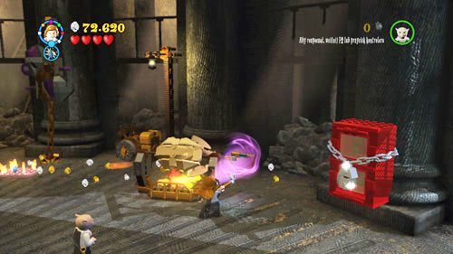 Kiedy wrócimy do sali ze smokiem kierujemy się do końca w lewo, silną postacią ciągniemy za pomarańczowy uchwyt - Klęska złodzieja | Znajdźki - Rok 7 | LEGO Harry Potter Lata 5-7 - LEGO Harry Potter: Lata 5-7 - poradnik do gry