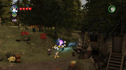 Przedzamcze - obok chatki Hagrida znajdziemy ucznia zniewolonego przez diabelskie pnącze, używamy Lumos by go uwolnić - Uczniowie w niebezpieczeństwie (2) | Dodatkowe znajdźki | LEGO HP Lata 5-7 - LEGO Harry Potter: Lata 5-7 - poradnik do gry