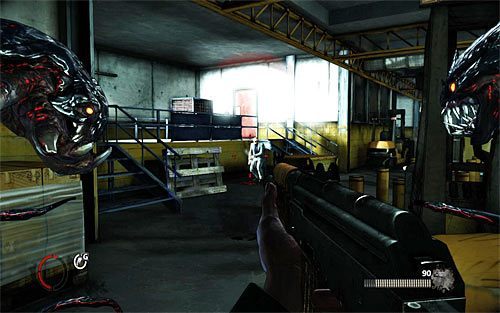 Już po dotarciu do strefy załadunku w końcowej części etapu rozejrzyj się za drzwiami po lewej stronie, które są oświetlane przez reflektor (powyższy screen) - 07 - 13 | Relikty The Darkness II - The Darkness II - poradnik do gry