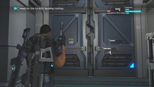 Gdy już oczyścimy teren przechodzimy przez metalowe rozsuwane wrota do pomieszczenia z pomarańczowymi kontenerami - Rozdział 3 Bad Ground (2) | Opis przejścia Binary Domain - Binary Domain - poradnik do gry