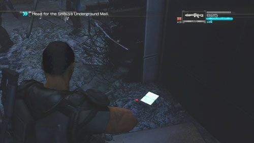 Trzymając się lewej strony dotrzemy do niewielkiej wnęki (tuż przed wyjściem na ulicę) ukryty został w niej Secur-Com - Rozdział 2 | Bonusy (Secur-Com) Binary Domain - Binary Domain - poradnik do gry