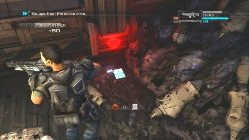 Za trzecią stertą złomu po prawej odnajdziemy Secur-Com - Rozdział 5 | Bonusy (Secur-Com) Binary Domain - Binary Domain - poradnik do gry