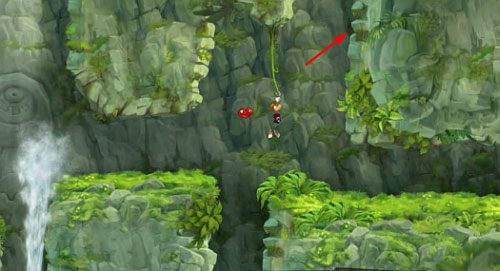 Kiedy dotrzesz do drzwi z okiem, tuż pod nimi znajduję się wejście do sekretnego pomieszczenia z E - Wybuchowe gejzery (300 L, 1:30) | Pokręcona Dżungla | Rayman Origins - Rayman Origins - poradnik do gry