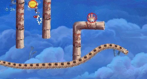 Przed samymi drzwiami z okiem, znajdziesz ukryte przejście do pomieszczenia z klatka z E - Podniebna sonata (300 L, 2:50); Bez odwrotu (175 L) | Pustynia Dijirdów - Rayman Origins - poradnik do gry