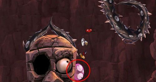 Teraz dostań się na półkę po prawej stronie z której biegnąc po ścianie skocz z na czubek głowy golema niszcząc ostatni bąbel - Ale w koło są Golemy (300); Świątynia Cwanych Skrzyń; Humorzaste Chmury | Mistyczny Szczyt - Rayman Origins - poradnik do gry