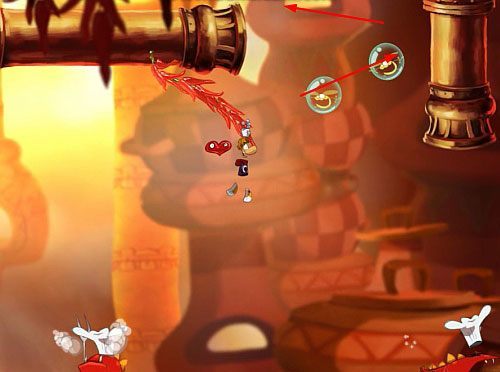 Po uwolnieniu Elektrun, idź dalej w prawo, aż zobaczysz parówkę na rożnie, na którą skocz z atakiem - Smocza zupa (300 L, 2:25) | Słodkie Jeziora | Rayman Origins - Rayman Origins - poradnik do gry