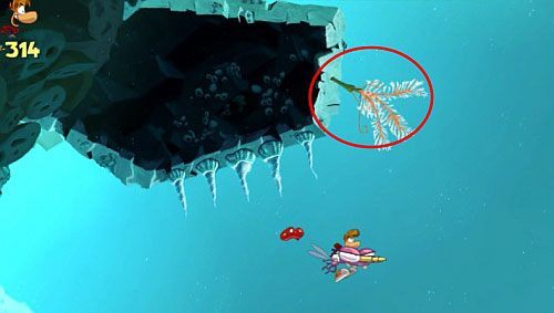 Na końcu poziomu czeka oczywiście klatka z E - Podwodna strzelanina (300 L) | Straszliwa Otchłań | Rayman Origins - Rayman Origins - poradnik do gry