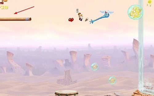 Kawałek dalej znajdziesz ostatnią na tym poziomie klatkę z E, której zniszczenie zakończy poziom - Szalone odbijanie (300 L, 1:30) | Pustynia Dijirdów | Rayman Origins - Rayman Origins - poradnik do gry