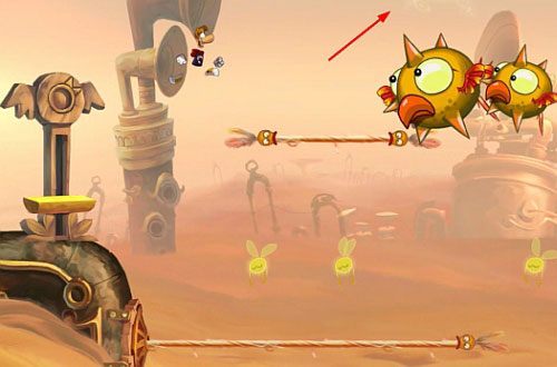 Dalej odbijaj się od ścian, by dostać się na platformę z przejściem do ukrytego pomieszczenia z klatką zawierającą E - Najlepszy podkład muzyczny (300 L, 2:00) | Pustynia Dijirdów | Rayman Origins - Rayman Origins - poradnik do gry