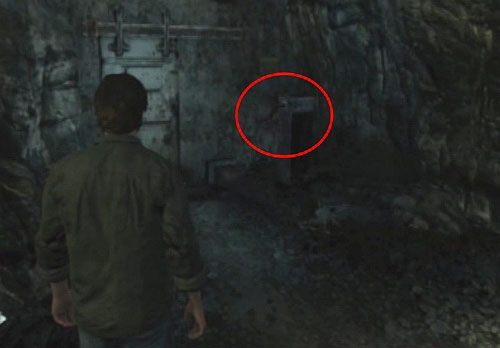 Dalej, obróć korbę po lewej stronie (kółko), aby otworzyć sobie drzwi - Misja główna - kolejka | Devils Pit | Silent Hill Downpour - Silent Hill: Downpour - poradnik do gry
