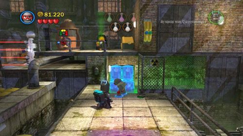 Użyj magnezu na niebieskich pojemnikach w tle (obrazek), a kiedy się wysuną wskocz po nich na górę i zbierz kolejną próbkę chemikaliów - Przepis na katastrofę | Opis przejścia LEGO Batman 2 DC Super Heroes - LEGO Batman 2: DC Super Heroes - poradnik do gry