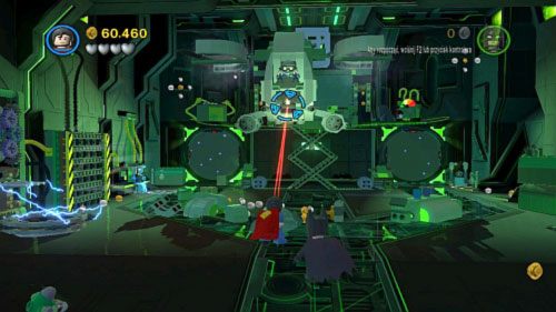 Po wejściu do wnętrza statku użyj linki na uchwycie we wrogim pojeździe latającym, a potem laserem pozbądź się pilot (obrazek) - Kierunek - Metropolis | Opis przejścia LEGO Batman 2 DC Super Heroes - LEGO Batman 2: DC Super Heroes - poradnik do gry