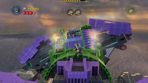 Namierz rakietnicą trzy srebrne klocki na lewej łopatce robota (obrazek) - Kierunek - Ziemia | Opis przejścia LEGO Batman 2 DC Super Heroes - LEGO Batman 2: DC Super Heroes - poradnik do gry