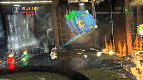 Przejdź w prawo i skorzystaj z magnezu Cyborga, żeby ściągnąć na dół niebieskie urządzenie (obrazek) - Nie wierzę w wieże | Opis przejścia LEGO Batman 2 DC Super Heroes - LEGO Batman 2: DC Super Heroes - poradnik do gry