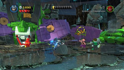 Po eksplozji użyj bata Wonder Woman lub linki Batmana na dwóch uchwytach, które pojawią się na ramieniu robota (obrazek) - Bohaterowie, do boju | Opis przejścia LEGO Batman 2 DC Super Heroes - LEGO Batman 2: DC Super Heroes - poradnik do gry