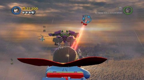 #01 - 05 - Podczas atakowania robota Jokera będą pojawiać się kontenery z dwoma balonami (dwa na początku i trzy po zniszczeniu silnika w jednej stopie) - Kierunek - Ziemia | Minizestawy LEGO Batman 2 DC Super Heroes - LEGO Batman 2: DC Super Heroes - poradnik do gry