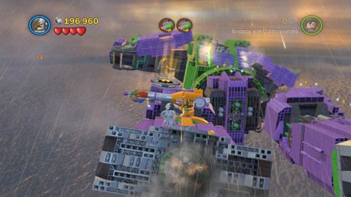 #07 - Użyj magnezu na niebieskim klocku na lewej nodze robota (będziesz mógł to zrobić po przebraniu Batmana w pancerz wspomagany) - Kierunek - Ziemia | Minizestawy LEGO Batman 2 DC Super Heroes - LEGO Batman 2: DC Super Heroes - poradnik do gry