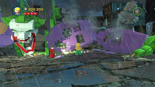 #10 - Wyciągnij uchwyt z lewego barku robota i zmyj wodą zieloną plamę z ziemi - Bohaterowie, do boju | Minizestawy LEGO Batman 2 DC Super Heroes - LEGO Batman 2: DC Super Heroes - poradnik do gry