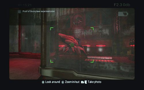 Musisz zrobić zdjęcie stojącej za szybą maszyny, która wystrzeliwuje wiązki laserowe - OSCORP Secret Lab 4 - Znajdźki - Niesamowity Spider-Man - poradnik do gry