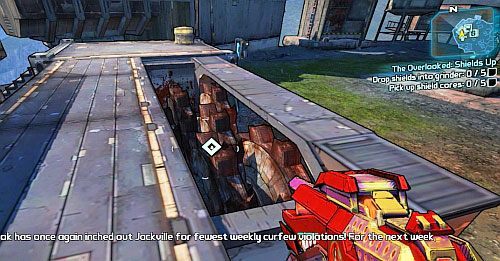Po przyjęciu zadania, Twoim celem będzie wrzucenie pięciu tarcz, do rozbijarki [2] pokazanej na obrazku - The Overlooked - Shields Up | Misje poboczne - The Highlands | Borderlands 2 - Borderlands 2 - poradnik do gry