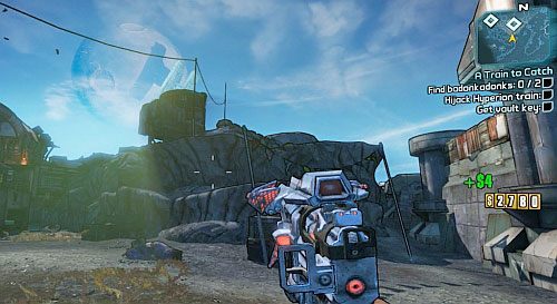 Pierwszą znajdziesz przed budynkiem, na wzniesieniu, na prawo od wejścia do obozu (obrazek) - A Train to Catch | Zadania główne w Borderlands 2 - Borderlands 2 - poradnik do gry