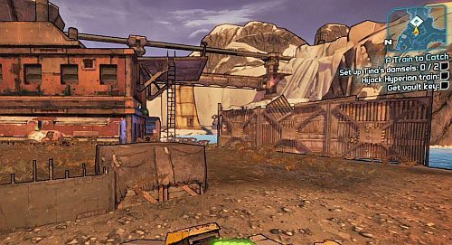 Wejdź po drabinie na dach budynku pokazanego na obrazku i umieść oba pociski na pozycjach, a następnie uzbrój je - A Train to Catch | Zadania główne w Borderlands 2 - Borderlands 2 - poradnik do gry