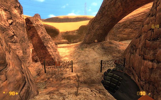 Znajdziesz przejście do pokrytej minami polanki, o czym poinformuje Cię stojący nieopodal brązowy znak z trupią czaszką - Surface Tension - Między minami | Surface Tension | Black Mesa - Black Mesa - poradnik do gry