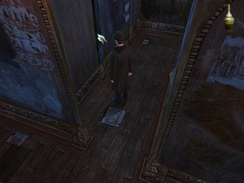 Nasmaruj go zatem oliwą z butelki zabranej z gabloty z bronią i popchnij ściankę, by zmienić jej położenie - Dostań się na drugą stronę galerii | Finał w opuszczonym lunaparku - Testament Sherlocka Holmesa - poradnik do gry