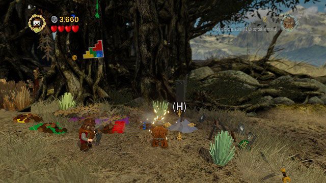 Gdy grupa Aragorna przejdzie do drugiej lokacji w jej prawym-górnym rogu znajdziemy mithrilową flagę wbitą w kamień - Tropem Hobbitów | Znajdźki | LEGO The Lord of the Rings - LEGO The Lord of the Rings: Władca Pierścieni - poradnik do gry