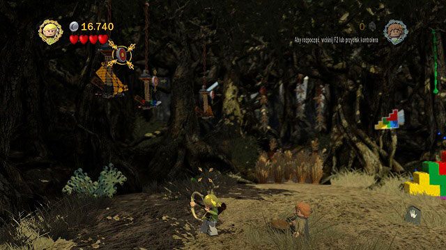 Musimy strzelić do trzech tarcz znajdujących się wysoko nad nami a następnie złożyć skrzynię - Tropem Hobbitów | Znajdźki | LEGO The Lord of the Rings - LEGO The Lord of the Rings: Władca Pierścieni - poradnik do gry